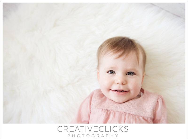 Children's-Photographer-Niagara_158 Sweet Baby Smiling On Fur Rug